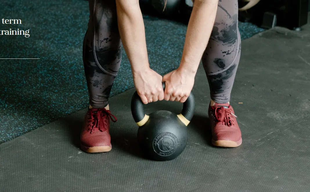 A Simply Strong Gym member training with a kettlebell